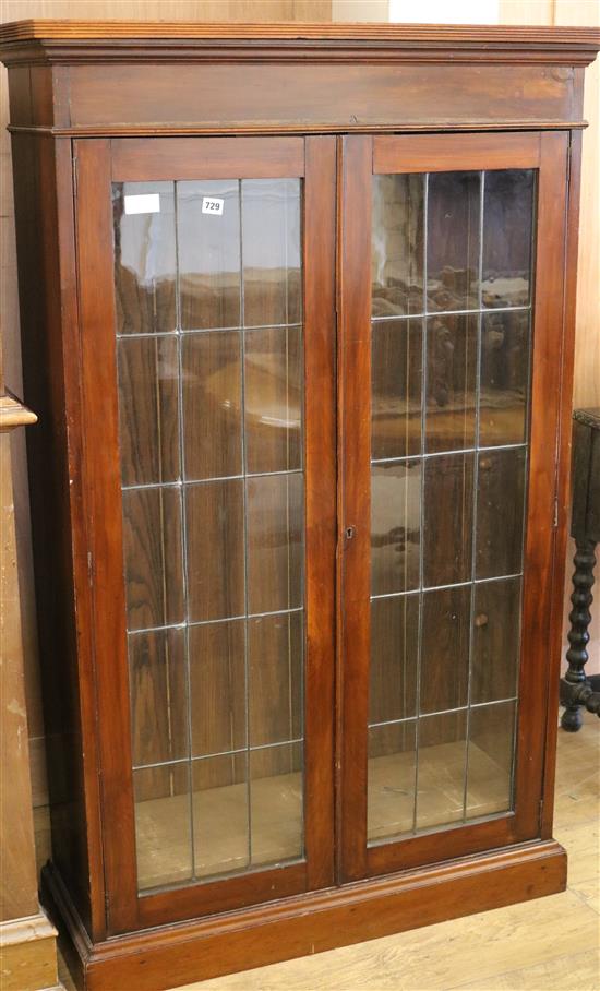 A bookcase with double glazed doors and three shelves W.92cm